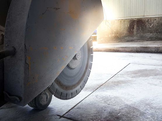 Wheel blade cutting concrete